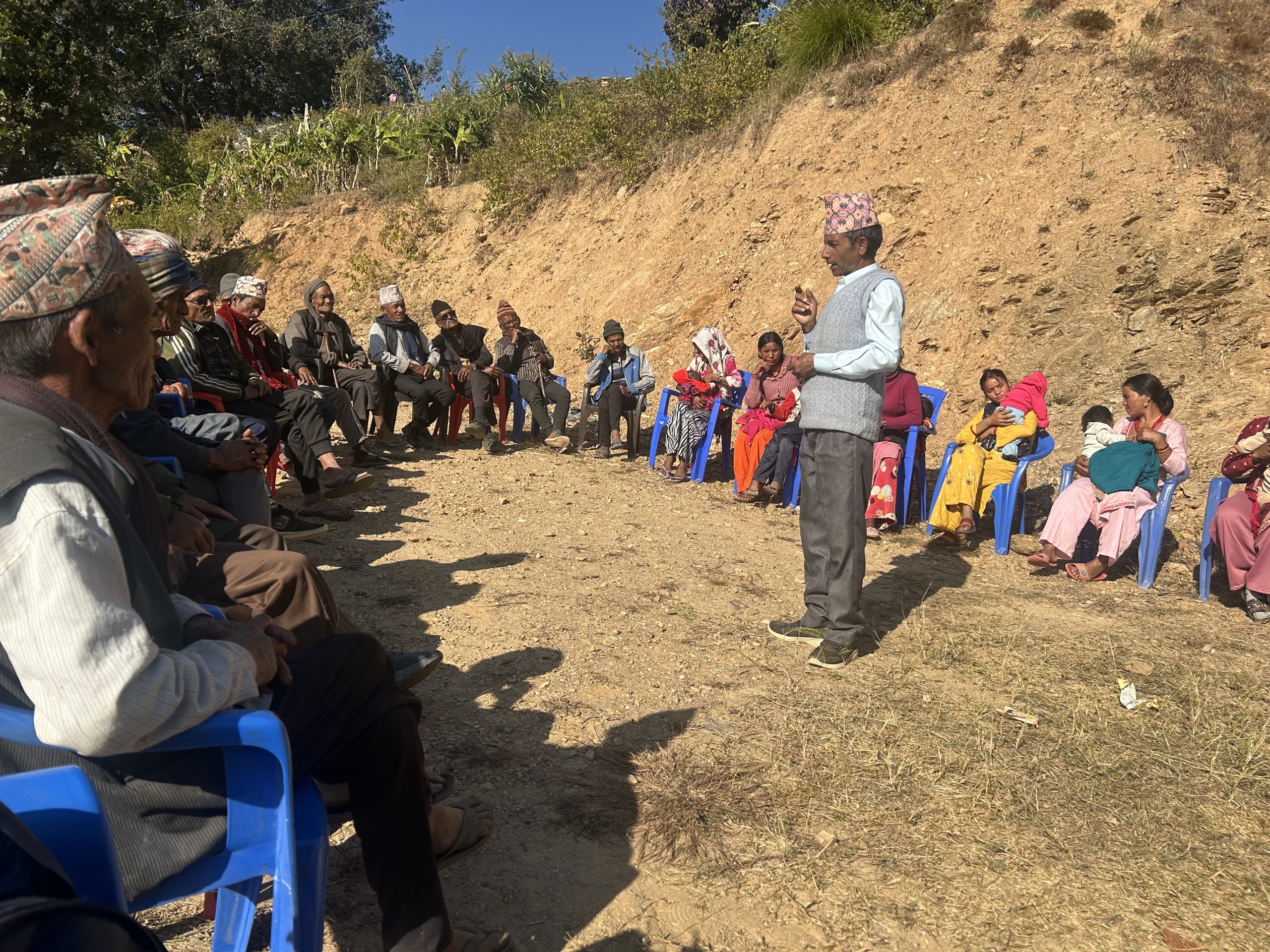 Kriparaj Bhattarai, a Hindu faith leader, conducting an awareness session on nutrition for mothers of children under 1,000 days and other community members in Mellekh, Achham.